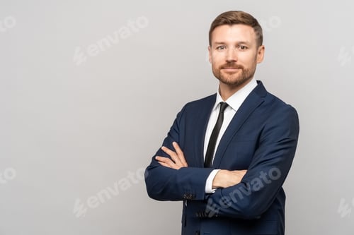 Preview: Man in business suit on studio gray background. Manager, director of company, successful businessman