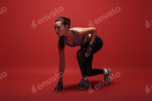 Preview: Getting ready. Attractive young sportswoman is ready to run