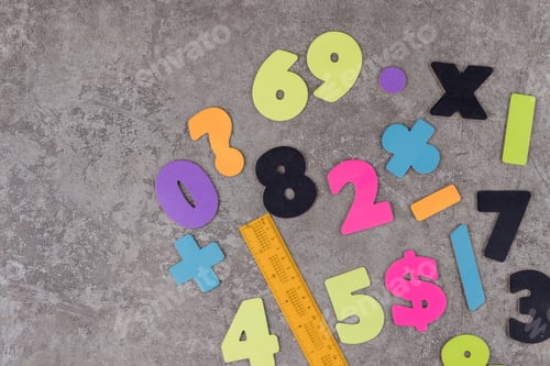 Preview: School stationary and numbers on grey background.