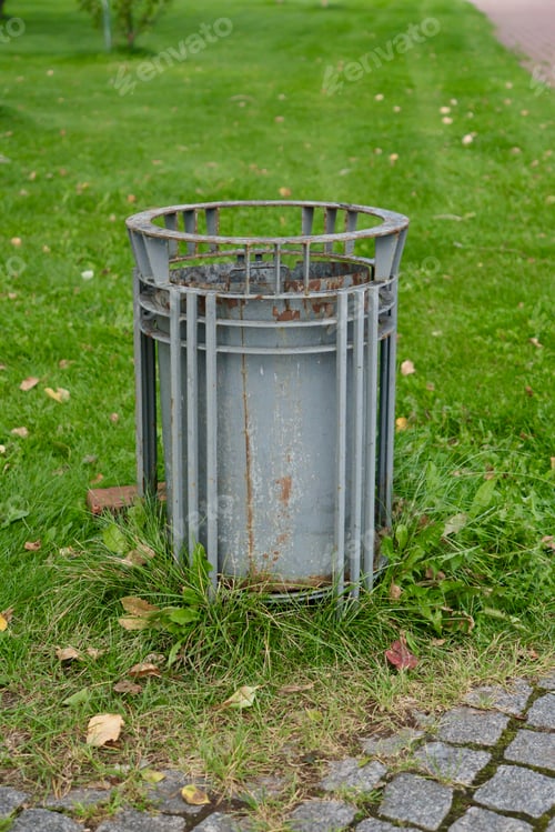 Preview: public trash can on city street filled with garbage. plastic waste in trash can container.