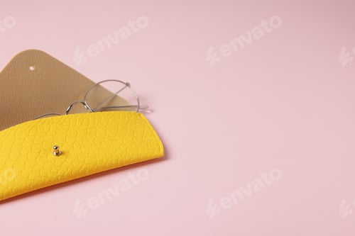 Preview: Case with stylish glasses on light pink background. Space for text