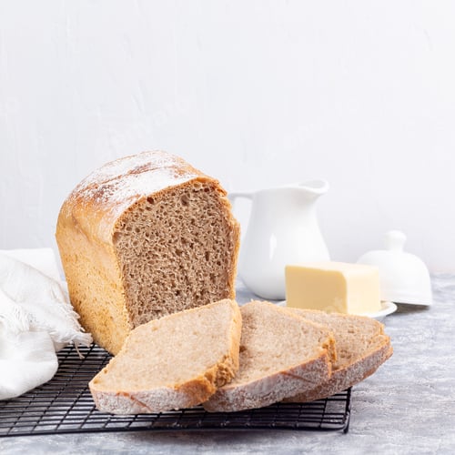 Preview: Slices of homemade no knead sandwich bread on cooling rack, square format