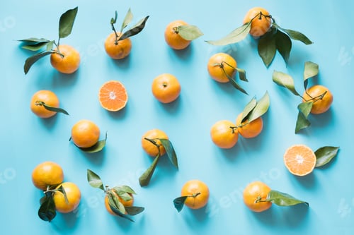 Preview: Fresh mandarin isolated on blue punchy pastel. Top view. Fruits pattern.