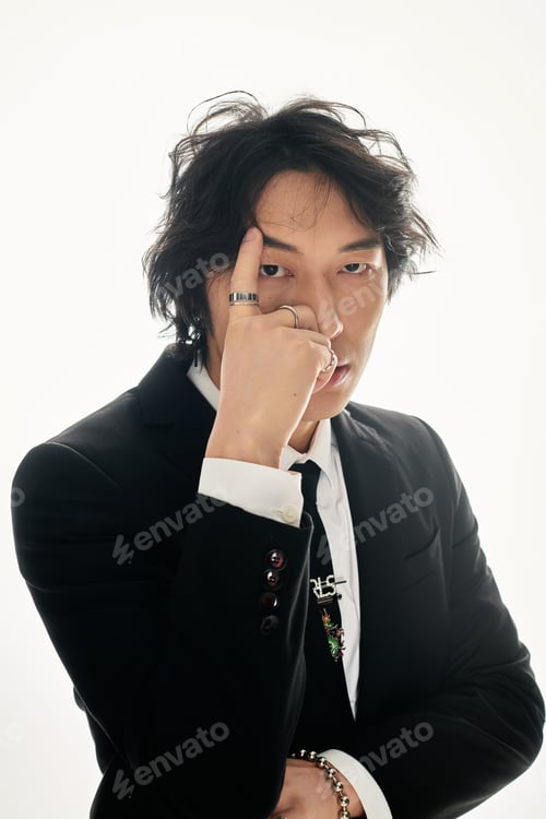 Preview: Young Asian man exudes modern charisma in stylish formal attire with a confident pose