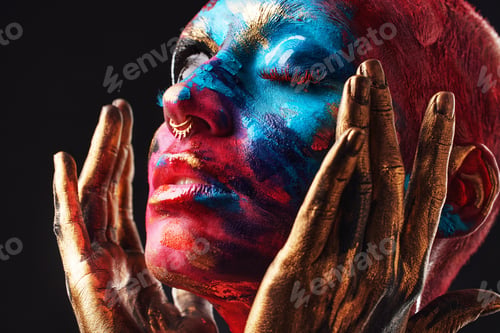 Preview: Shot of an attractive young woman posing alone in the studio with paint on her face