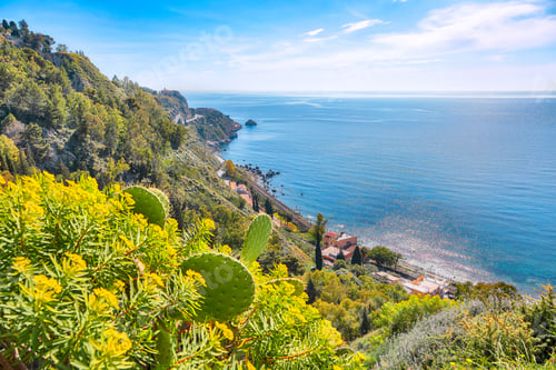 Preview: Awesome aquamarine blue waters of sea near Taormina resorts and Etna volcano mount.