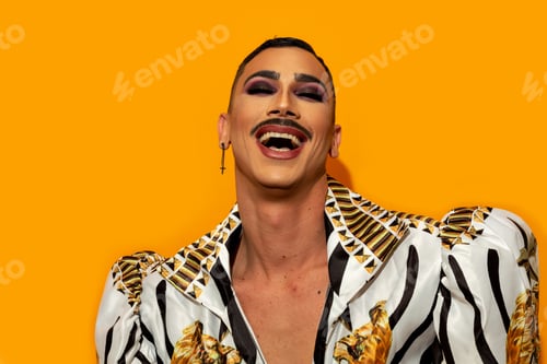 Preview: Happy gay man laughing with yellow background