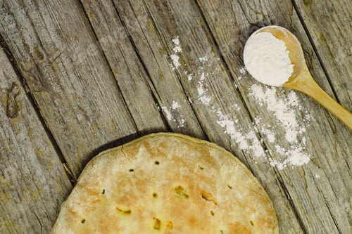 Preview: Pizza Calzone on old wooden table