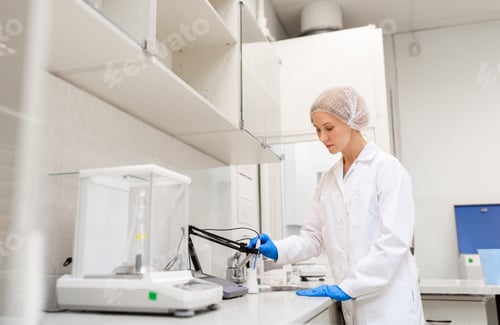 Preview: scientist with flask making test at laboratory