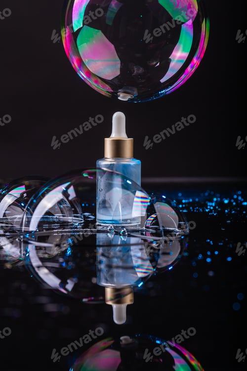Preview: Perfume bottle and bubbles on black background.