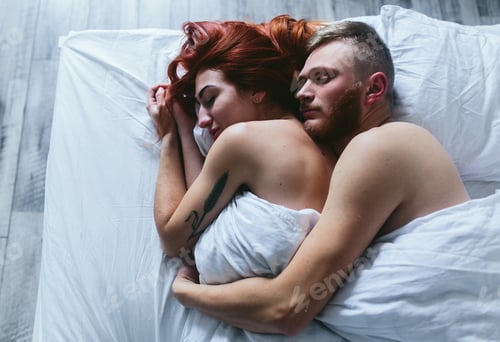 Preview: Young couple in bed together