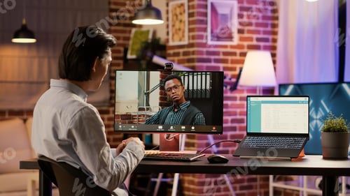 Preview: Male employee meeting with manager on remote videocall
