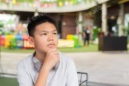 Preview: Teenage boy thinking and looking up