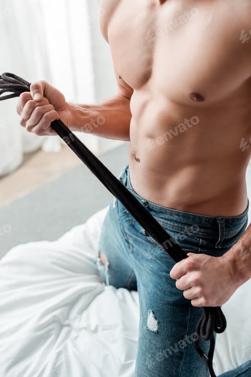 Preview: cropped view of dominant man standing on knees and holding rope