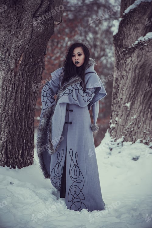 Preview: Fairytale Young Woman Dressed In Long Sleeved Coat At Winter With Snow Outdoors
