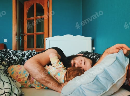 Preview: Father and Child Napping Peacefully in Bedroom