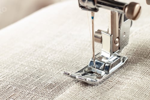 Preview: Modern sewing machine presser foot and item of clothes. Sewing process, handmade, hobby, business