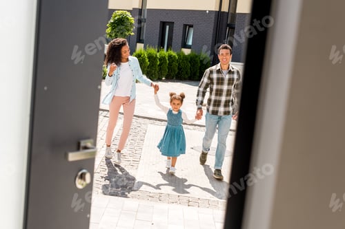 Preview: full length view of african american parents holding hands with kid while walking into house