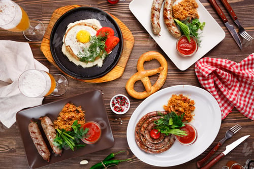 Vorschau: Different sausages with sauerkraut and beer