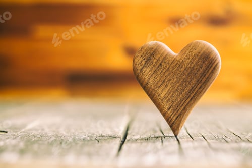 Preview: Wooden heart on wooden table.