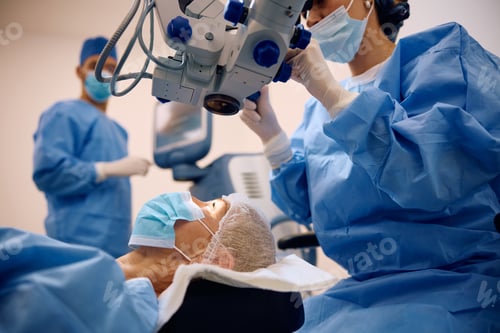 Preview: Mature female patient undergoing eye surgery at the ophthalmology clinic.