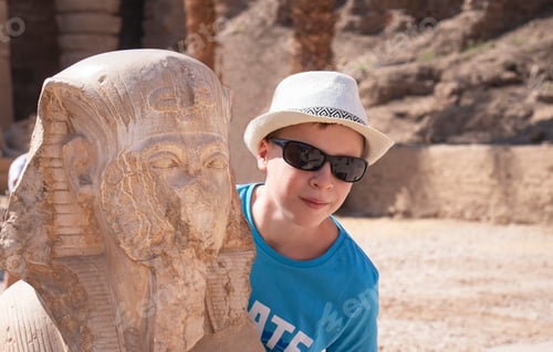 Preview: a boy with a sculpture of the Temple of Koptos in Egypt