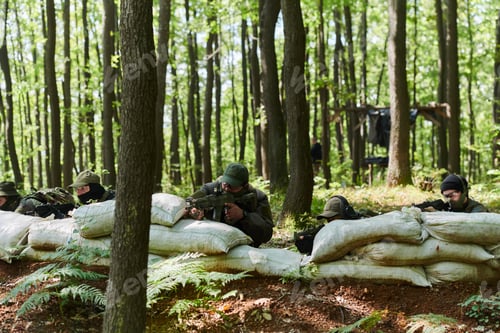 Preview: A disciplined and specialized military unit, donned in camouflage, strategically patrolling and