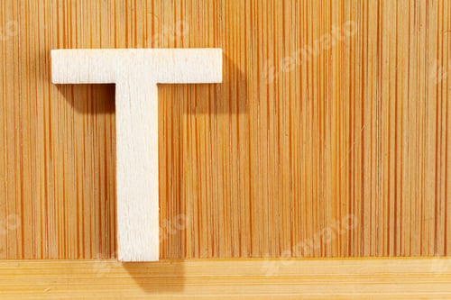 Preview: Letter T of wood-made alphabet, top view and space for text