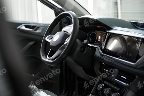 Preview: Modern car interior, steering wheel and dashboard
