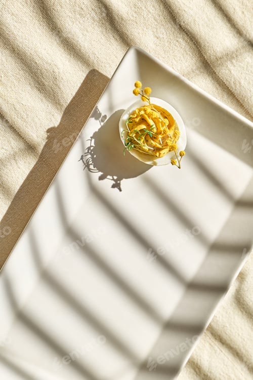 Preview: Stuffed easter eggs mimosa with egg yolk, turmeric, cream cheese and cress salad.