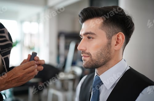 Preview: Professional actor preparation before shoot. Handsome young man applying by professional make up.
