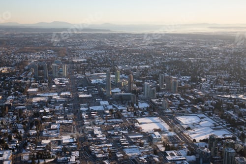 Preview: Aerial view of Surrey Central during a vibrant sunset after a snow fall