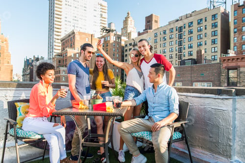 Preview: Group of friends having party on a rooftop