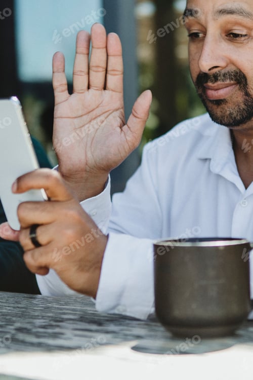 Preview: Man using mobile phone