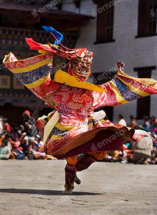 Preview: Masked performer dancing at festival, Punakha, Bhutan