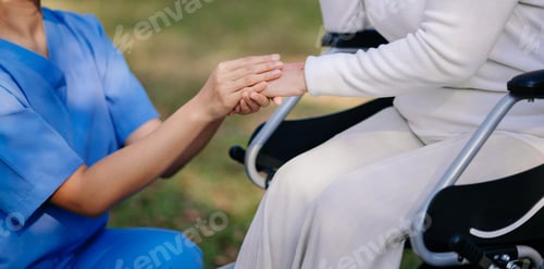 Preview: Asian young caregiver nurse support senior older male walking outdoors. Specialis doctor help and