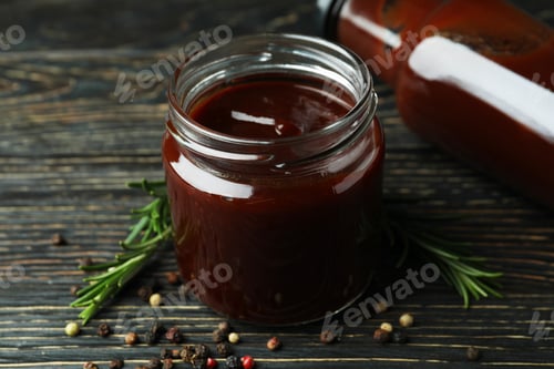 Preview: Barbecue sauce and spices on wooden table