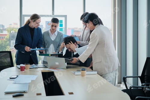Preview: Male boss is overwhelmed with marketing partner colleagues and busy paperwork.