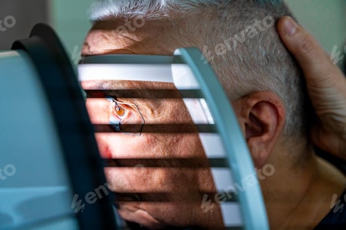 Preview: Senior man receiving a laser treatment for glaucoma