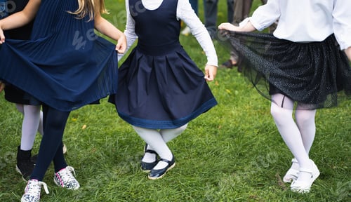 Preview: Back to elementary school concept. Dancing girls children go to first grade.Ceremony of graduating.W
