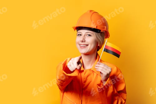 Preview: woman worker in helmet and orange overalls with German flag