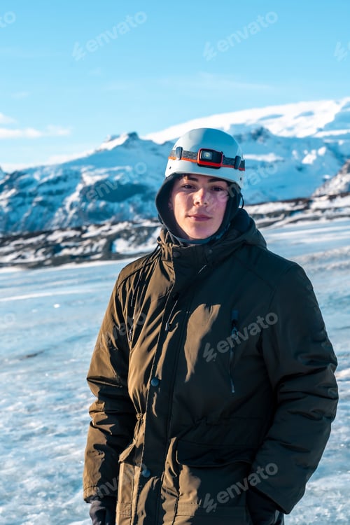 Preview: Portrait of an adventurous young man on the Vatnajokull glacier in winter in Iceland