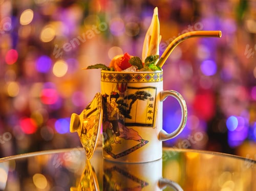Preview: Exotic cocktail in porcelain cup served on table
