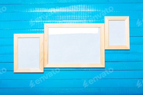 Preview: photo frames on the wooden wall