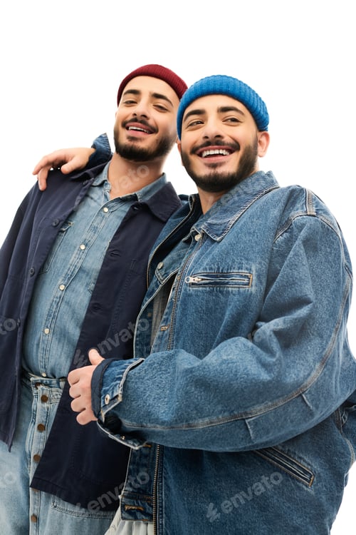 Preview: Twins dressed in stylish denim and cozy beanies share a joyful moment together