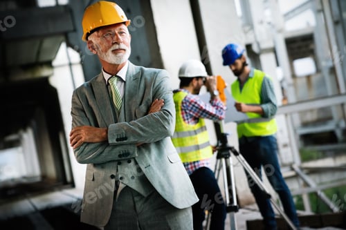 Preview: Architect and construction engineer or surveyor discussion plans and blueprints