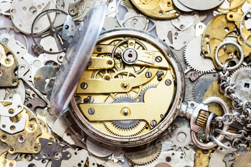 Preview: open vintage pocket watch on heap of spare parts