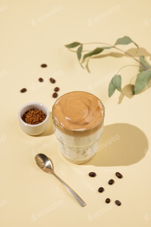 Preview: Vegan dalgona coffee. Whipped instant iced coffee with soy milk in a glass