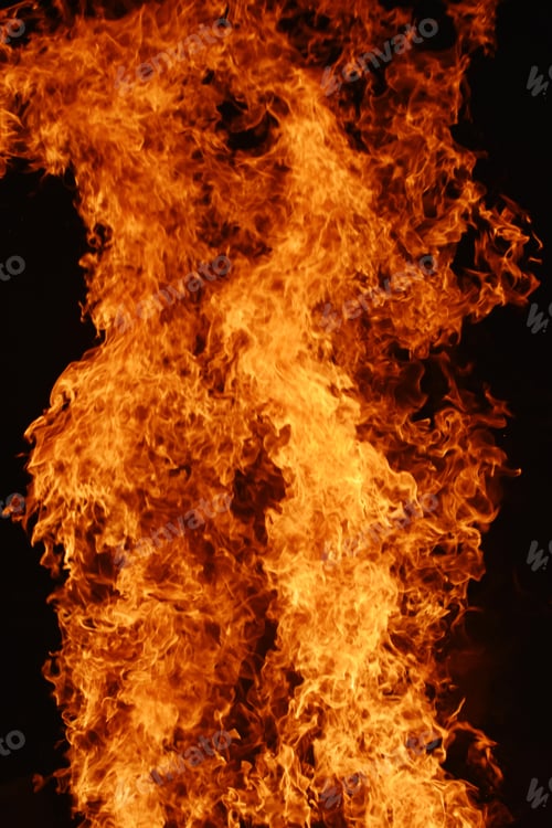 Preview: Vertical closeup shot of campfire at the time of festival
