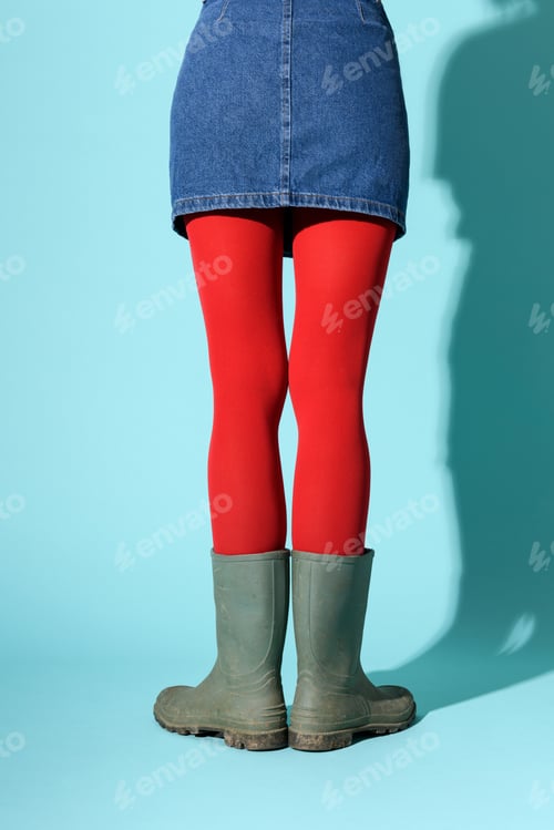 Preview: Anonymous woman in rubber boots and red tights